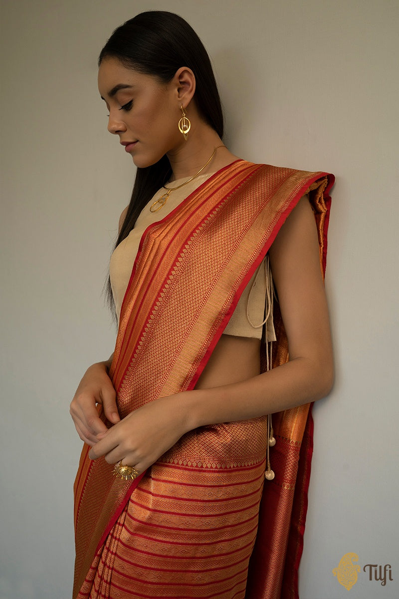 The subtle and rhythmic weave of fine silk threads cover the entire body of  this Banarasi Tanchoi silk saree with a striking contrast…